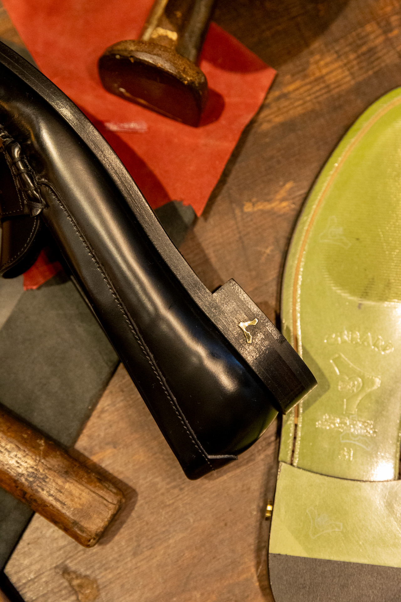 Leather, penny loops and a pin on the heel